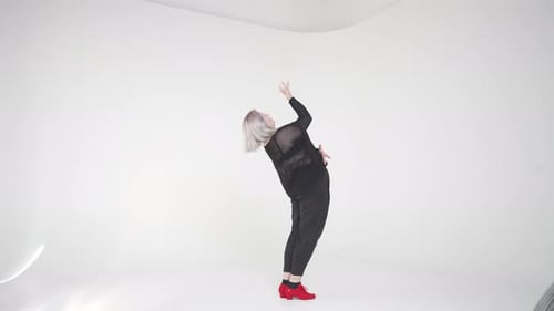 An Exquisite and Stylish Dance Performance Presented in a Minimalist Studio Setting