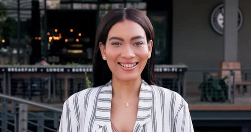 Face, smile and freedom with a woman in the city looking happy for travel as a confident young