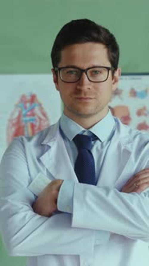 Confident Young Adult Doctor Poses in Clinic