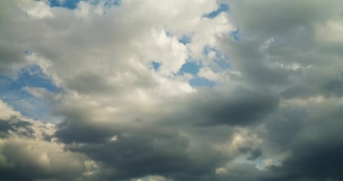 Timelapse of Clouds Drifting Across Blue Sky