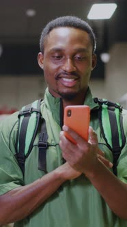 A Person is Seen Checking Their Smartphone in a Modern and Contemporary Setting