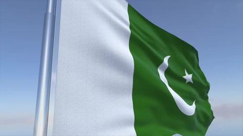 Waving National Flag of Pakistan Against Blue Sky