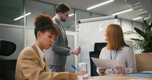 Team Discussing Business Strategy in Modern Office