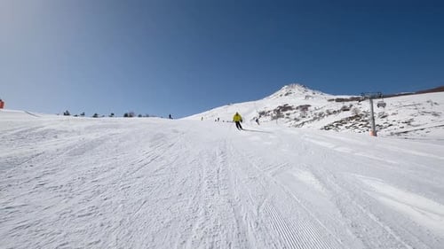 Group Of People Skiing On The Mountain