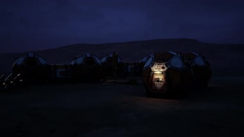 Mars Colony Base Illuminated at Night with Habitats in the Dark Landscape