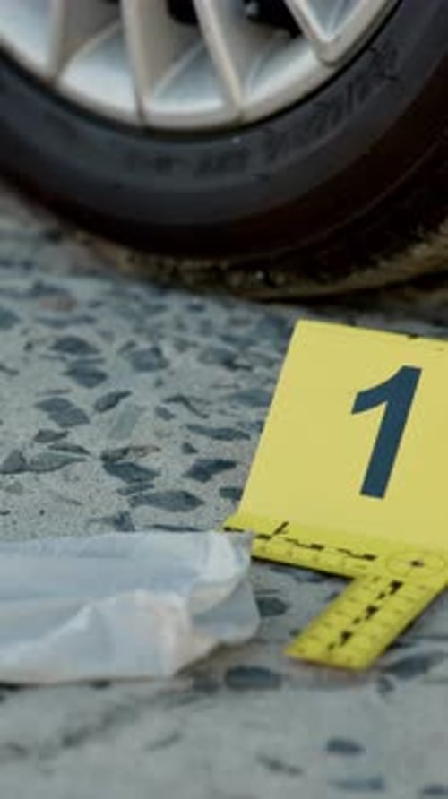 Crime scene, evidence and forensic investigation on road with label for accident