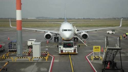 Plane on Runway Ground Equipment Passenger Access