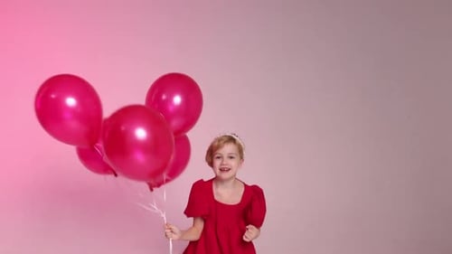 Girl with Balloons Celebrates Birthday in Studio