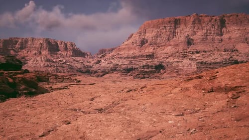Expansive Rocky Landscape Under a Dramatic Sky in a Remote Desert Region