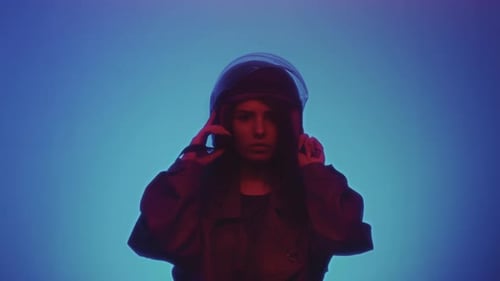 Young Woman Puts on Futuristic Helmet