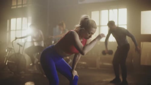 Woman Resting After Intense Workout in Gym