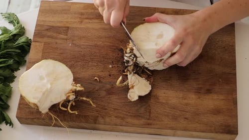 Preparing Celery Root on Cutting Board Indoors