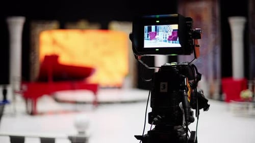 Professional camera filming with on the backstage of a TV set