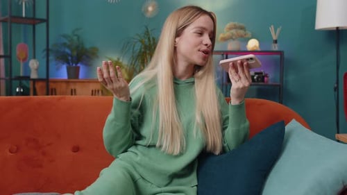 Woman Speaking on Cell Phone at Home