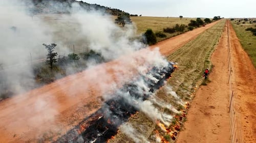 Drone flyover follows firefighter igniting planned burn in wildfire danger zone