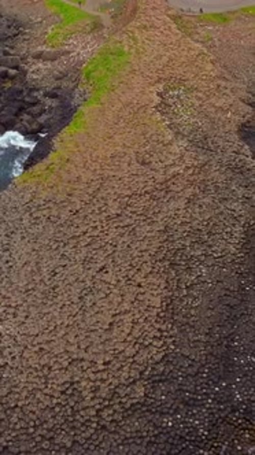 Orbiting social ratio aerial video of The Giant's Causeway in Bushmills, Antrim, Northern Ireland