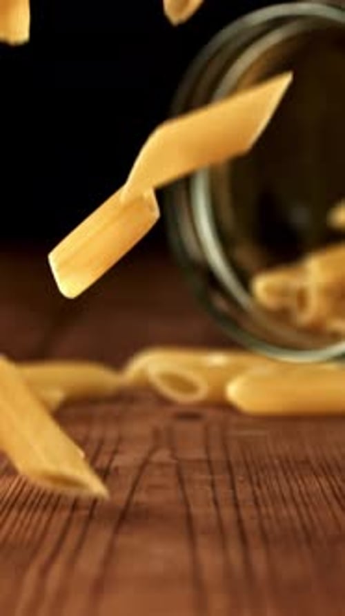 Super Slow Motion Dry Penne Pasta Filmed on a Highspeed Camera at 1000 Fps