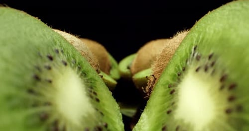 kiwi fruit cut in half super close up shoot fly over 4k high quallity shoot on dark background