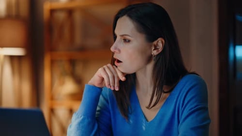 Woman Talks To Computer At Home at Night
