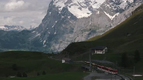 Establishing Shot of Swiss Valley with Train