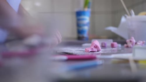 Baker Kneading White Fondant for Decoration