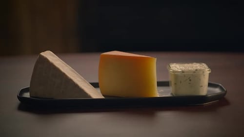 Cheese Board with Brie and Yellow Wedge Close-up