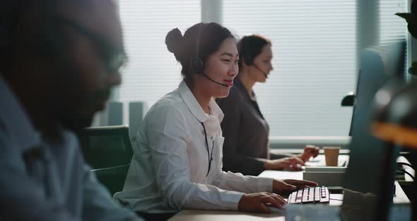 Call Center Control Room Side View of Team of Technical Customer ...