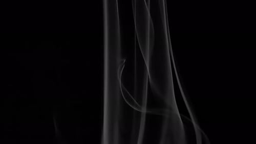 White Smoke Flowing on Black Background