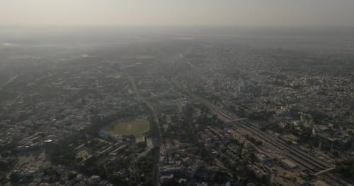 Aerial view of modern cityscape with roads, India.