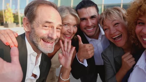 Happy Diverse Business Team Smiling and Waving Together