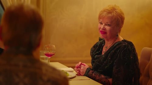 An Elderly Woman in a Black Dress Enjoys Her Evening in a Restaurant with Her Husband An Elderly