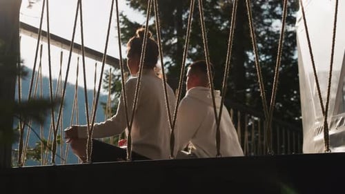 Woman and Young Adult Enjoying Serene Mountain View