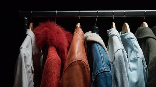 Trendy Winter Coats and Jackets Hanging on Rack