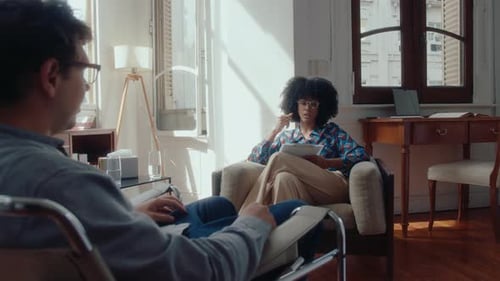 Woman Talking to Therapist in Calm Setting