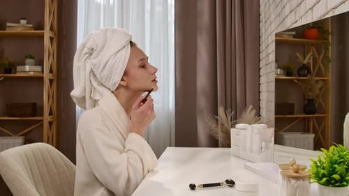 Woman Giving Herself a Facial Massage at Home