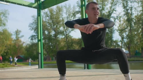 Gym Enthusiast Executing Intense Squats Under Shelter By Lake Active Male Engaging in