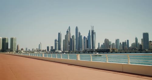 The embankment of the modern city with a view of the skyscrapers of the city center.