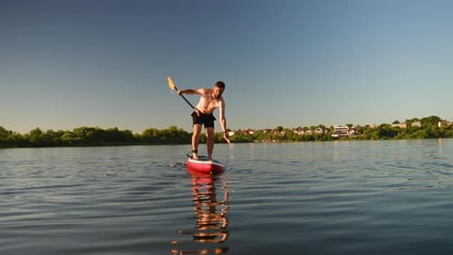 Sportsman Falling From Sup Board Into Lake