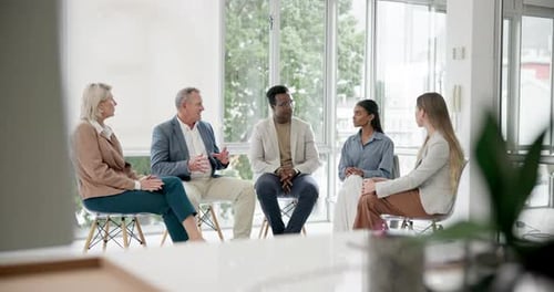 Group in therapy, businessmen and women in circle for discussion on support