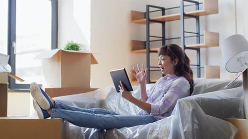 Moving, People And Real Estate Concept - Happy Smiling Asian Woman With Tablet Pc Computer And Bo...