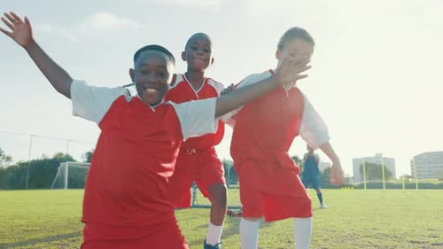 Soccer, hug and face of kids on field for teamwork, sports training or celebration support