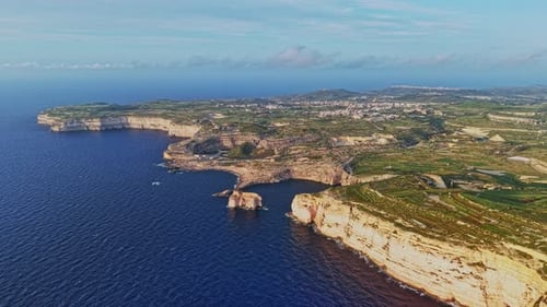 Explore the stunning coastal cliffs and azure waters of Malta at sunset