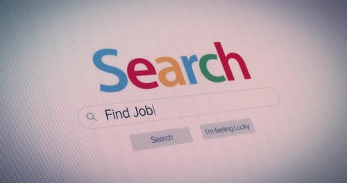 Phrase find a job texted in internet search engine line entry field on computer screen