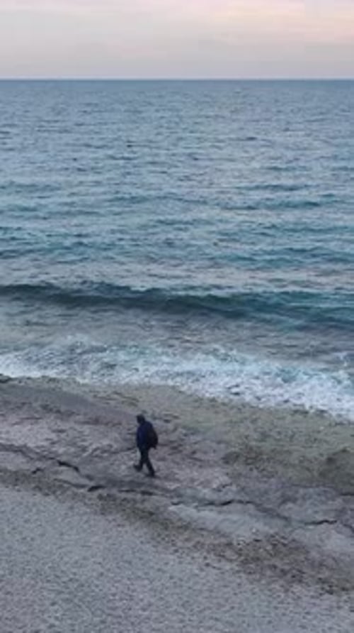 Vertical Video of a Pristine Beach on the Mediterranean Sea With Waves Gently Washing Ashore and a