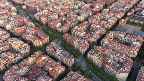 Barcelona city skyline, aerial view. Eixample residential district at sunrise. Catalonia, Spain