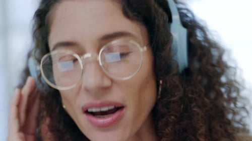 Friendly call center agent, customer service and telemarketing consultant wearing headphones