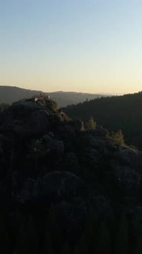 Vertical Video of Person on Mountain Viewpoint at Sunset