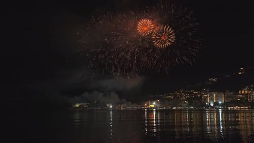 Fireworks with Colorful Lights Over Sea