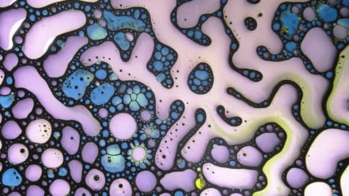 Colorful abstract fluid mixture with bubbles and textures swirling in liquid motion