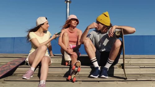 Group of Friends Enjoying Time Together at Skatepark